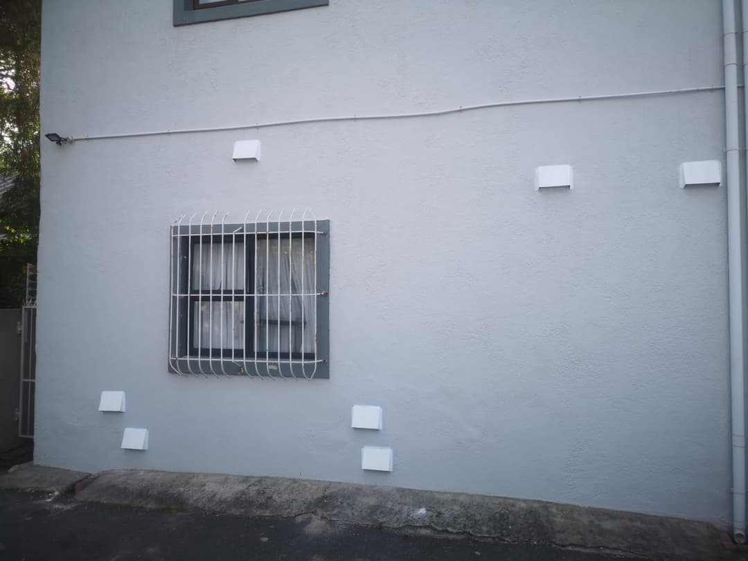 Six vent covers fitted across a house wall