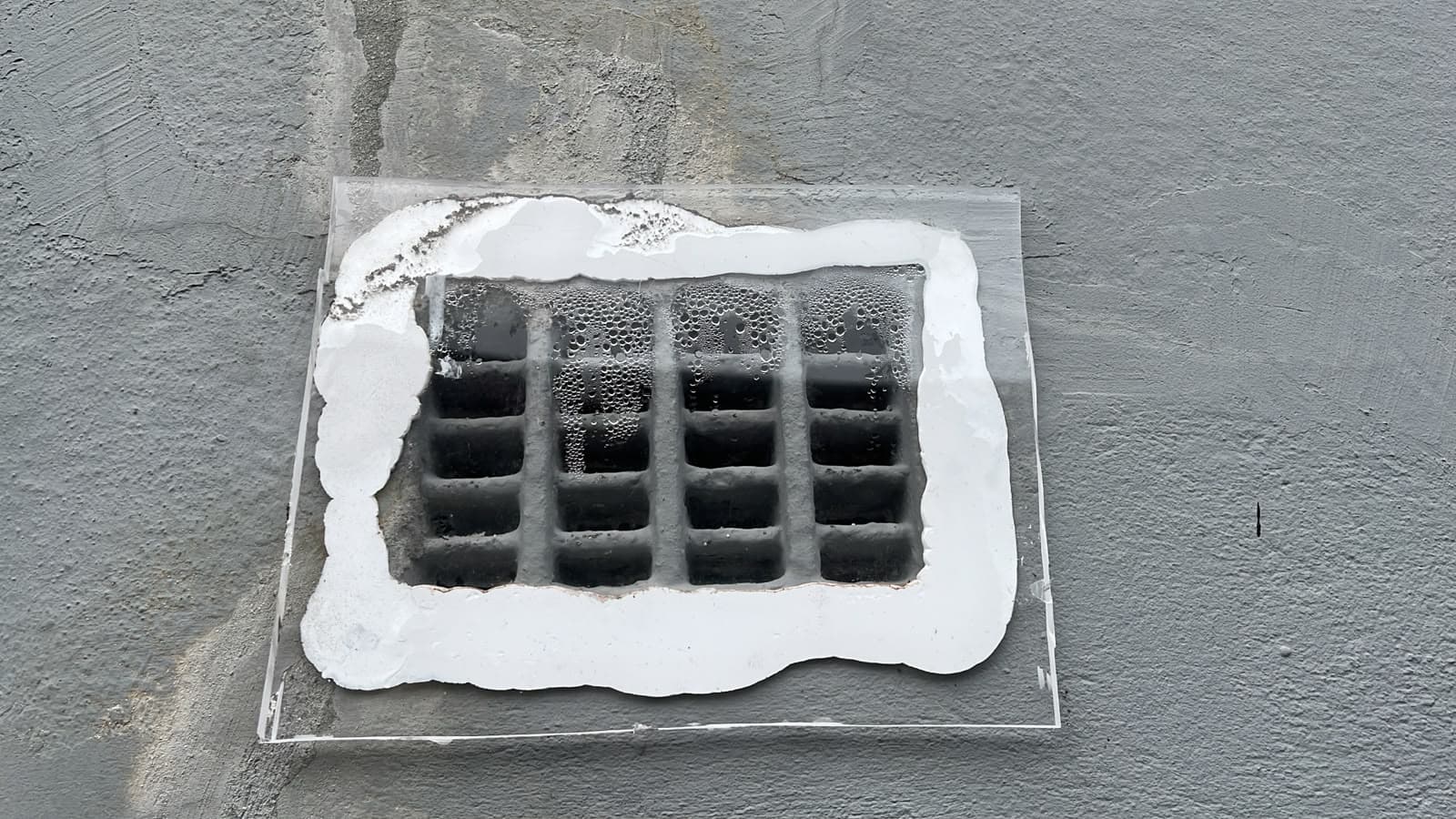 Vent sealed with fogged-up clear plastic sheeting
