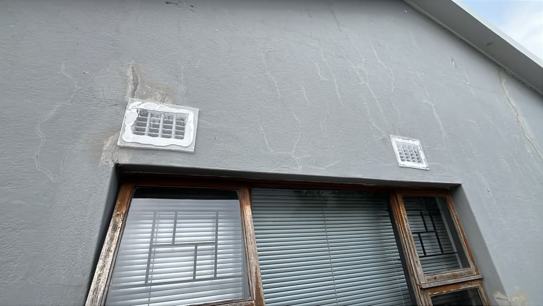Vents patched with clear plastic and sealant