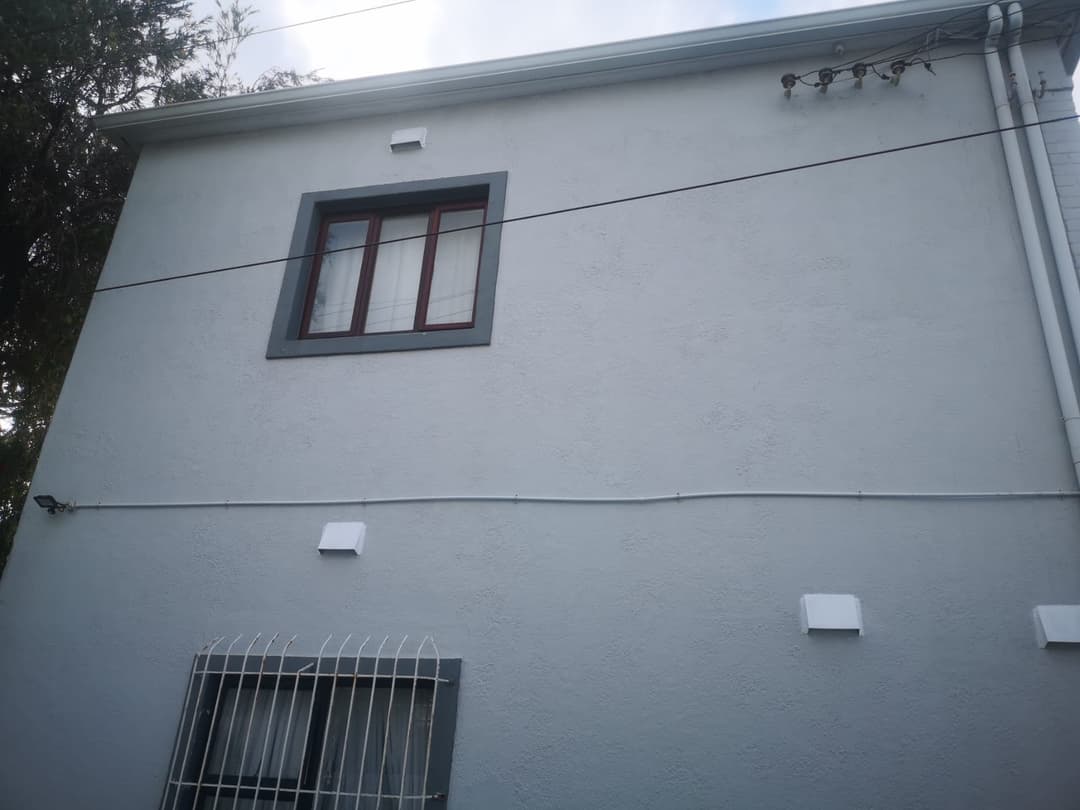 Vent covers fitted above and below the window